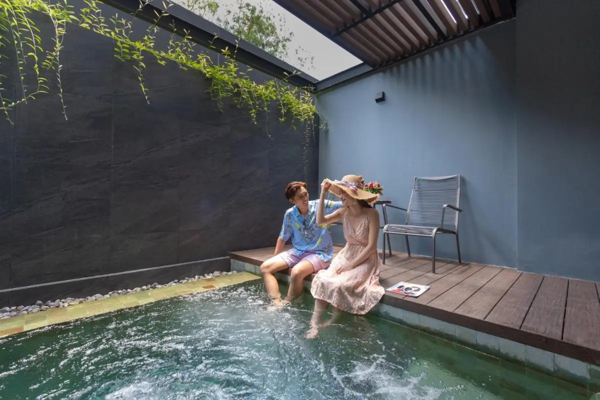 Tranquil Indoor Plunge Pool and Relaxation Area with Natural Light at Patong Beach