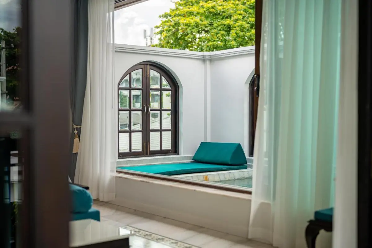 Tranquil Indoor Pool and Lounge Area with Jacuzzi Features in Phra Sing Chiang Mai