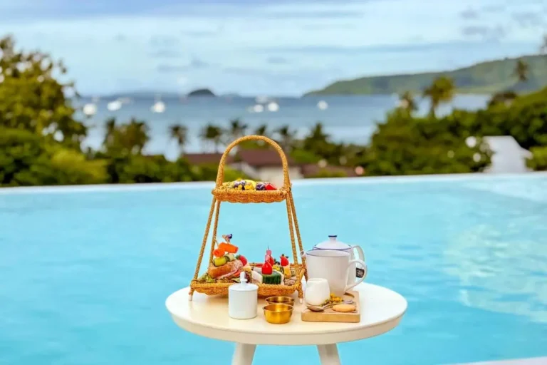 Tranquil Infinity Pool Overlooking Ocean with Refreshing Snacks at Rawai Beach