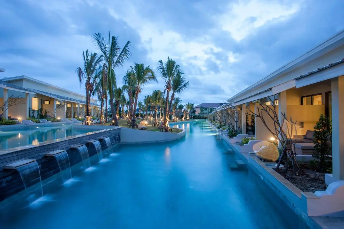 Tranquil Long Narrow Swimming Pool with Waterfalls and Landscaped Island in Phuket Town