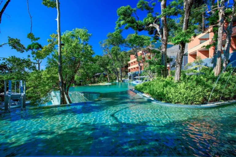 Tranquil Multi-Level Infinity Pool Surrounded by Lush Forest at Panwa Beach