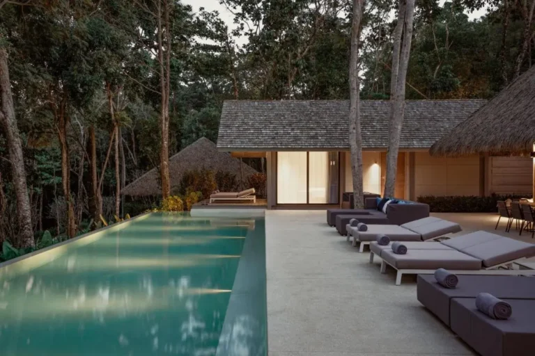 Tranquil Outdoor Infinity Pool and Lounge Area Surrounded by Forest in Phuket Town