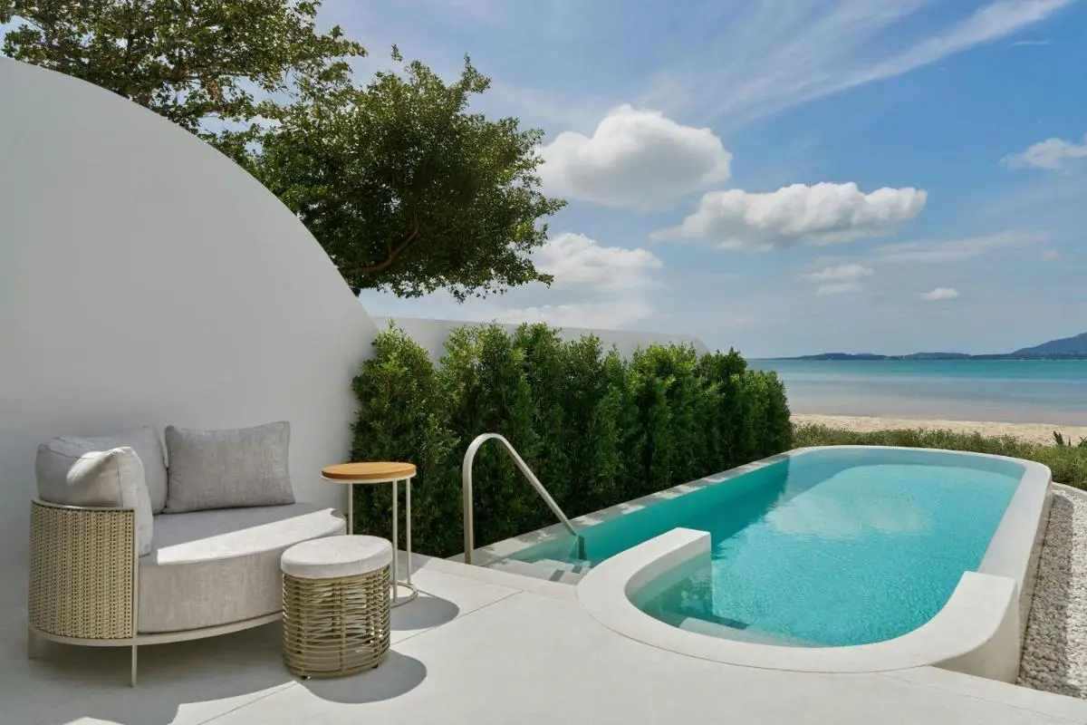 Tranquil Outdoor Pool and Seating Area Overlooking Panwa Beach and Ocean Views
