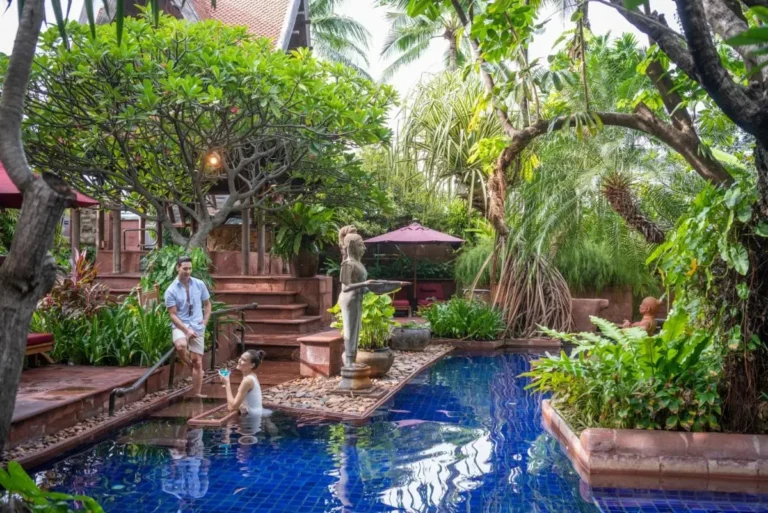 Tranquil Outdoor Pool and Spa Area Surrounded by Lush Tropical Vegetation in Bang Rak