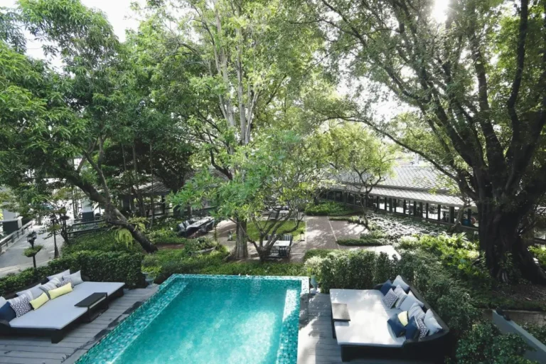 Tranquil Outdoor Swimming Pool and Garden Lounge Area in Phra Nakhon