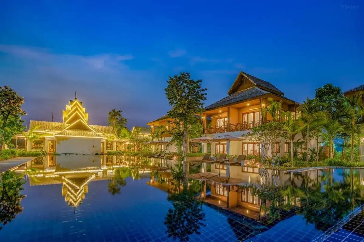 Tranquil Outdoor Swimming Pool and Lounge Area with Tropical Landscaping in Chiang Mai