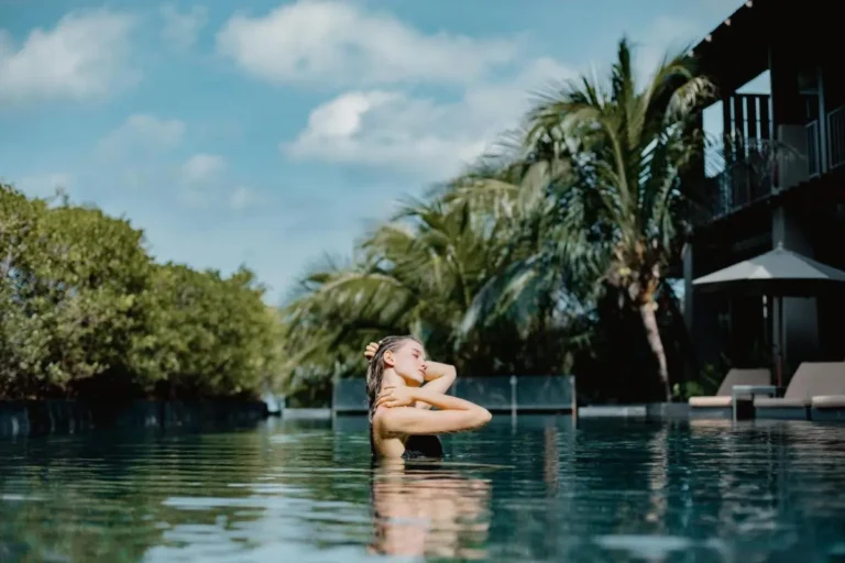 Tranquil Outdoor Swimming Pool Surrounded by Tropical Foliage at Patong Beach