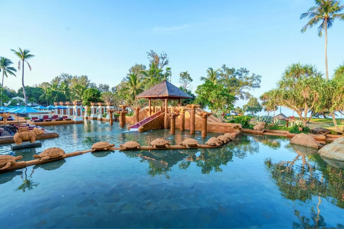 Marriott's Phuket Beach Club Tropical Outdoor Pool Area with Pavilion, Slide, and Ocean View at Mai Khao Beach