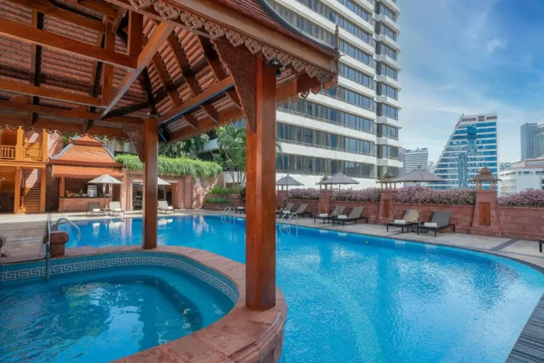 Urban Outdoor Pool and Jacuzzi Area with Traditional Pavilion in Khlong Toei Bangkok