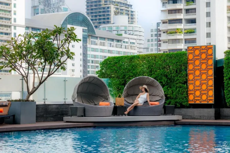 Urban Outdoor Pool and Lounge Area with Cushioned Chairs in Wattana Bangkok
