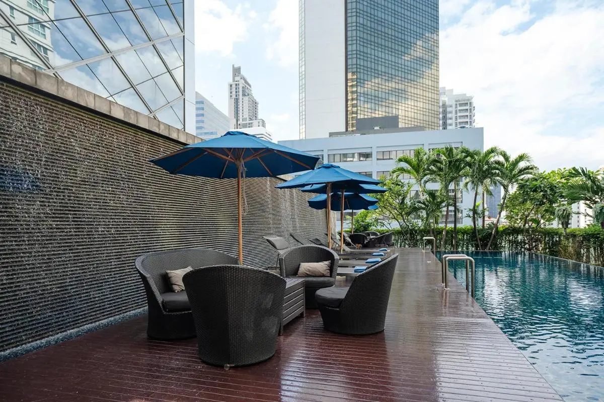 Hilton Bangkok Grande Asoke Urban Outdoor Pool Area with Lounge Seating and Water Feature in Wattana Bangkok