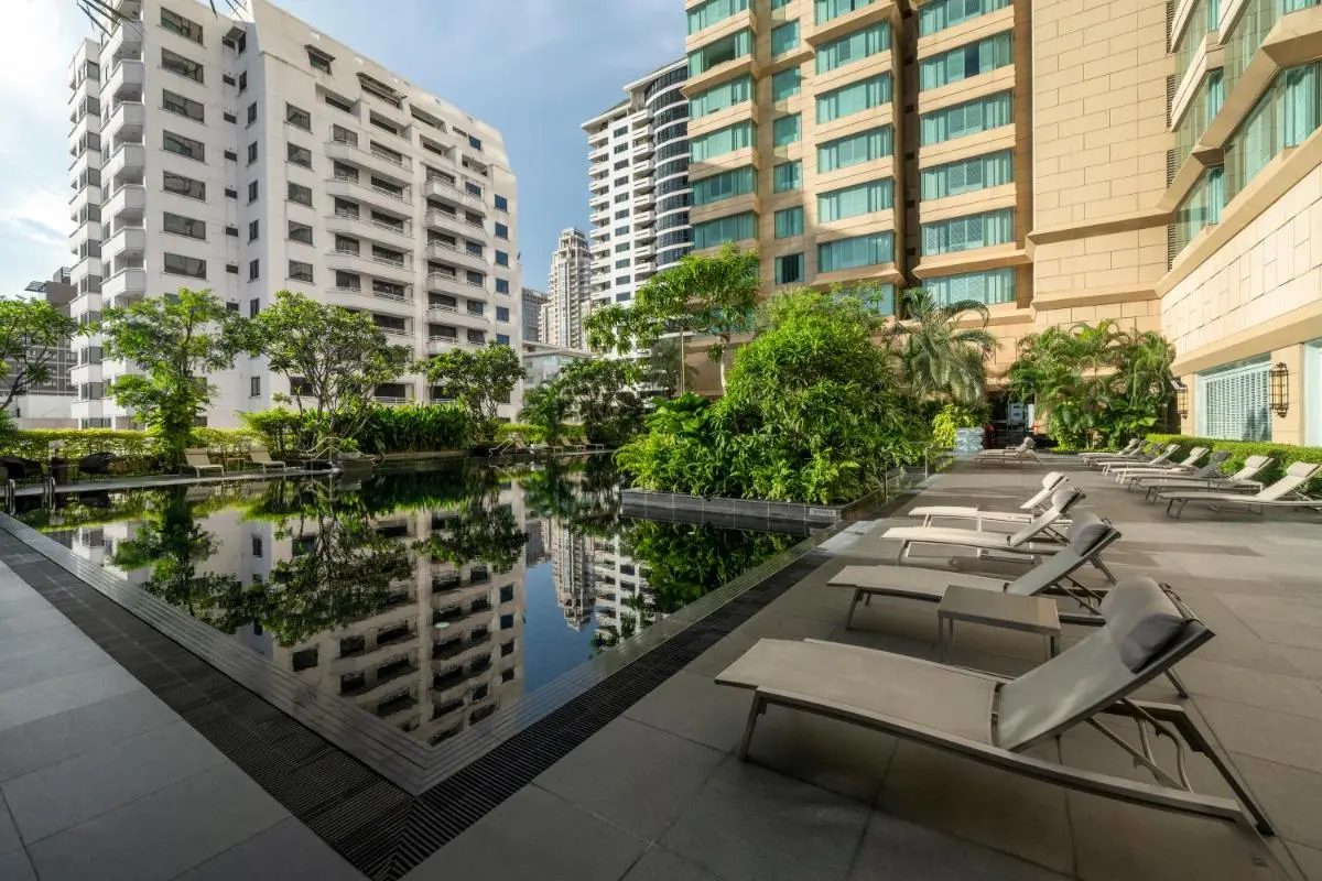 Grande Centre Point Hotel Ratchadamri Bangkok Urban Outdoor Rectangular Swimming Pool with Lounge Chairs and Greenery in Pathumwan City Thailand