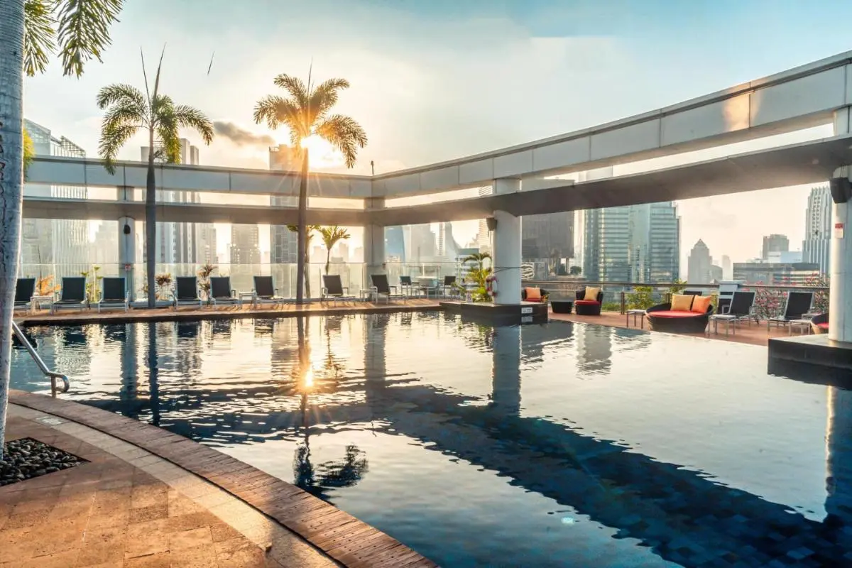 Urban Rooftop Swimming Pool with Lounge Seating and City Views in Pathumwan Bangkok