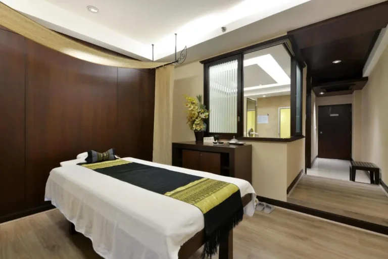 Wellness Treatment Room with Massage Table and Soft Lighting in Pathumwan Bangkok