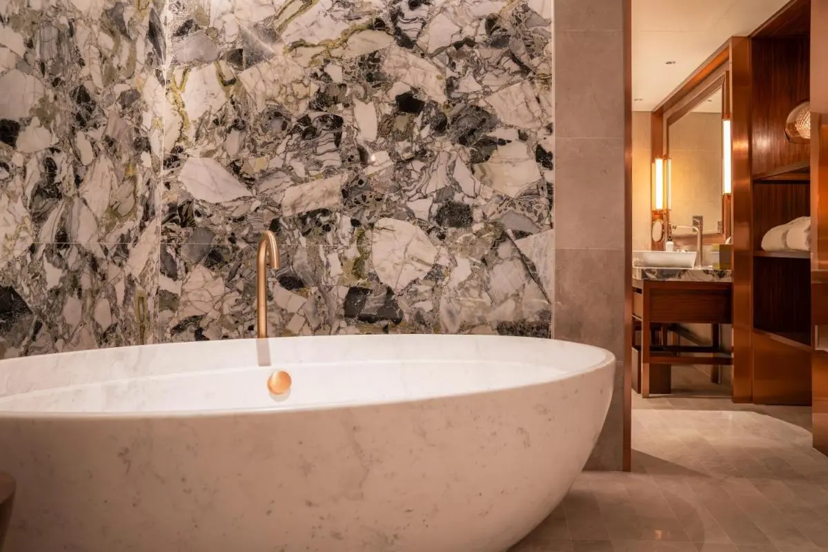 White Marble Bathtub and Wooden Vanity Bathroom Area Orchard Singapore